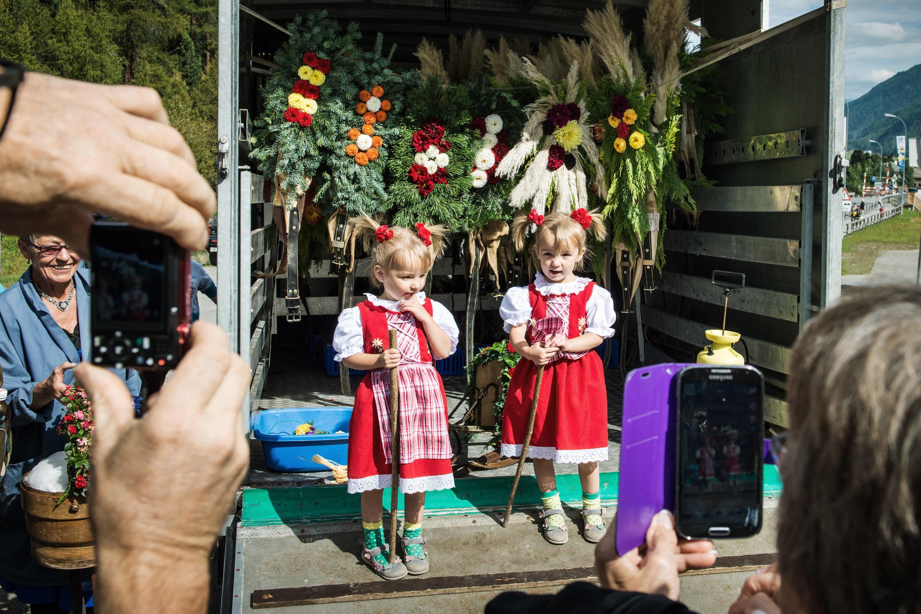 Flower-decorated alp-descent in the Emmental region